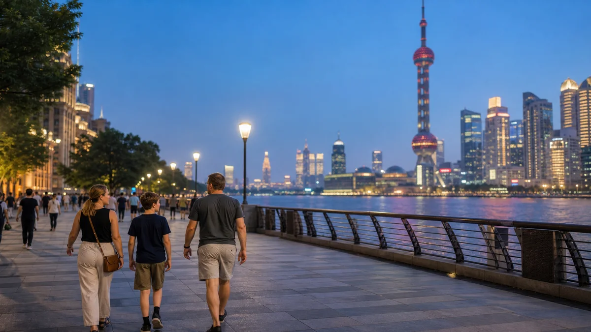 International family strolling along the Shanghai waterfront at blue hour