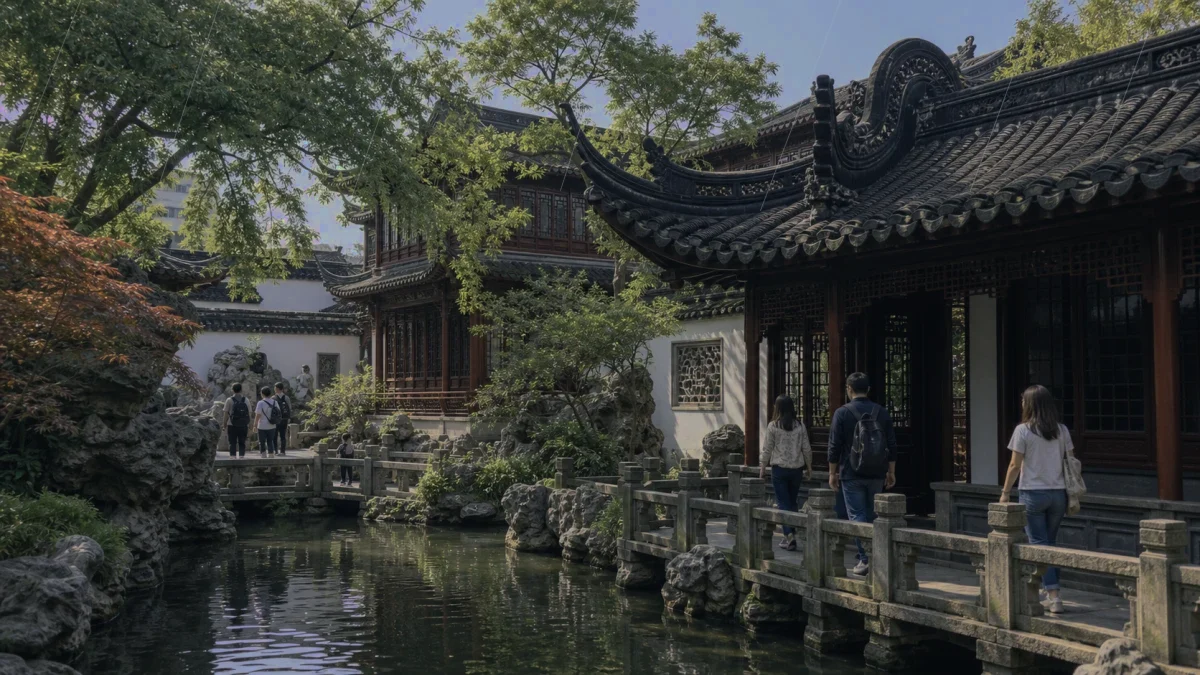 Travelers walking through a traditional Shanghai garden area on a cloudy day