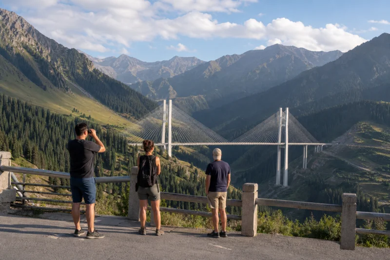 Travelers viewing Guozigou Bridge in the Tianshan mountains