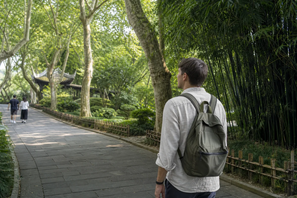 Traveler walking in a quiet Chengdu park with bamboo
