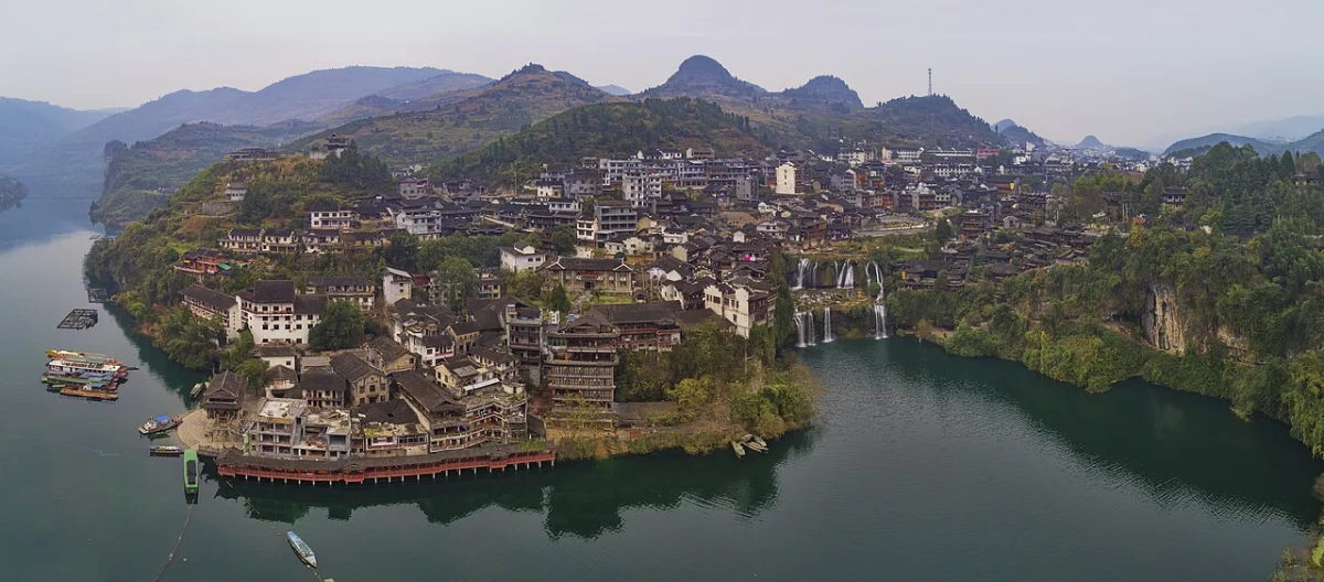 Aerial photograph showing Furong Town, river and waterfall in the hillside landscape